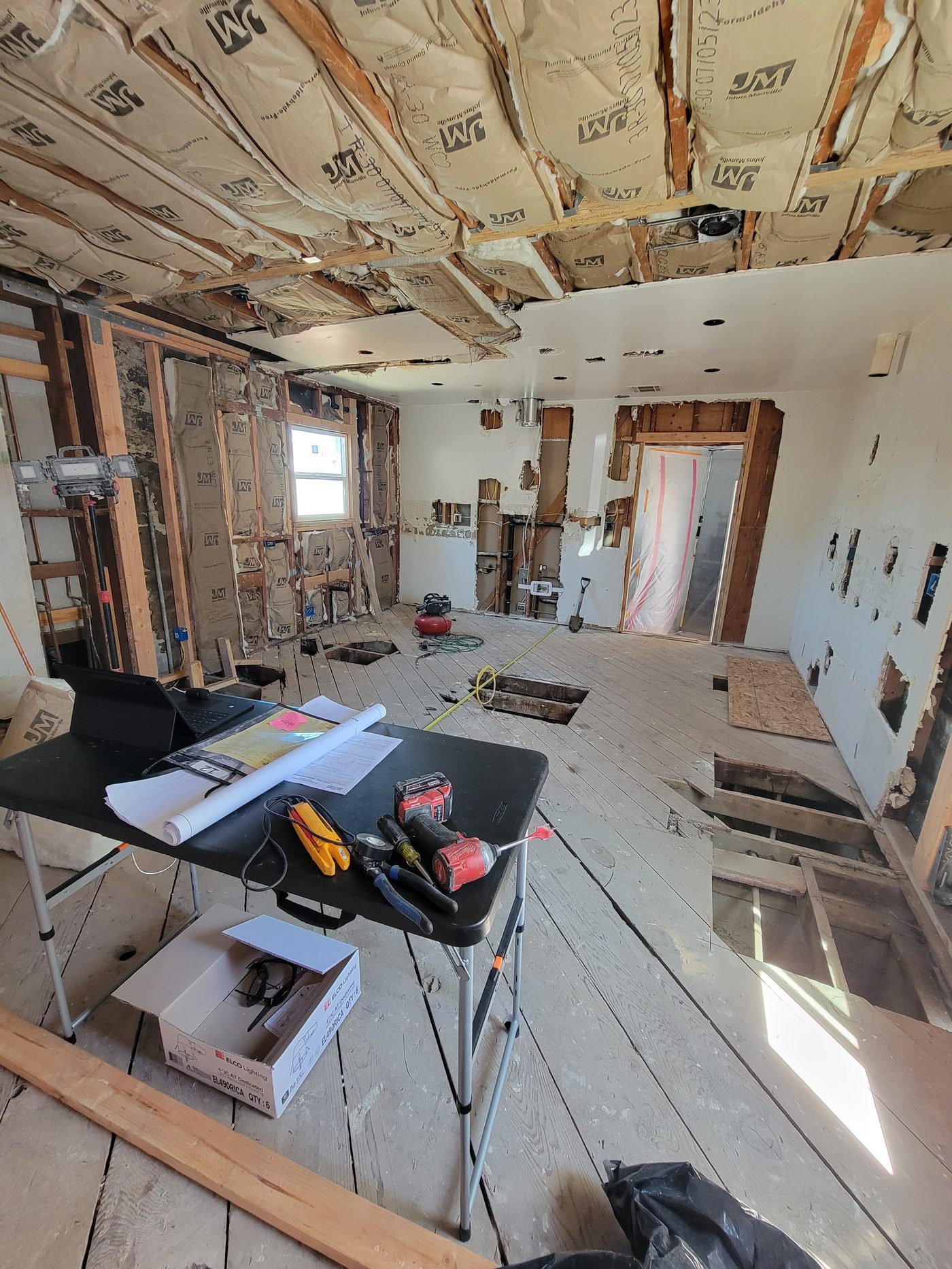 Before: stripped-to-studs kitchen during demolition in Gardena