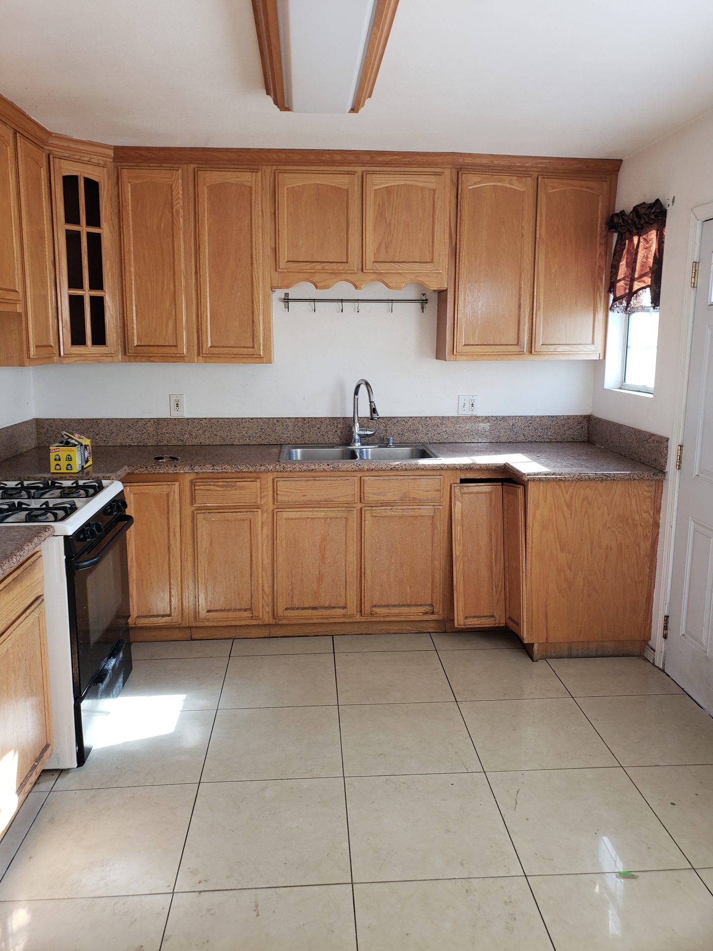 Before: dated oak cabinet kitchen in Los Angeles