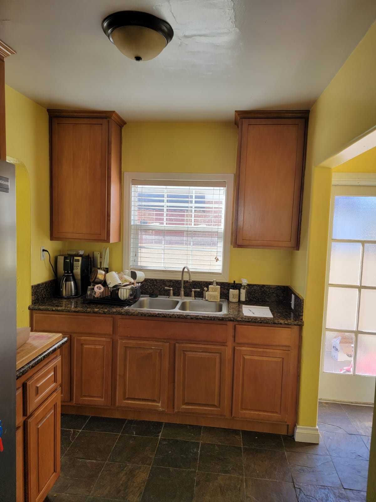 Before: original dated kitchen prior to remodel